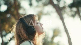 Listening headphones woman