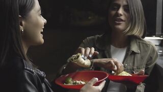 Girls holding their Food Tacos