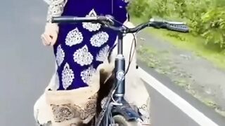 Beautiful girl riding biscycle