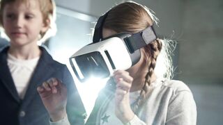 A Girl Wearing A Virtual Reality Headset