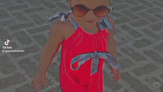 Baby in black glasses