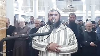 Moment Cat Jumps on Imam During Pray in Ramadan
