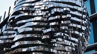 This giant kinetic sculpture is actually a shape-shifting human face.