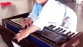 A little child trying to singing