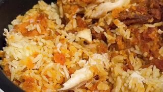 Yellow rice mixed with chicken