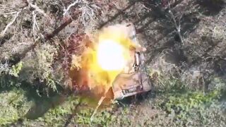 Ukrainian quadcopter UAV dropping a munition on a Russian T-80BV tank
