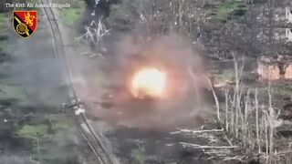 Russian tank explodes as soldiers pull survivors away from wreckage