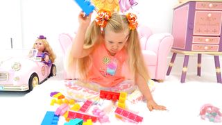 Diana and Roma Playing with Toy Blocks