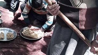 Village people making village routine food.