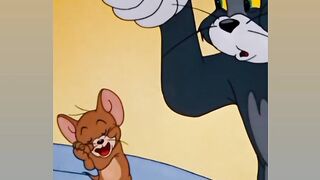 Tom and Jerry - tom was playing music and jerry was angry