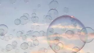 Have fun at sunset with soap bubbles