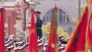 In scaled down military parade, Putin accuses west of seeking to destroy his country