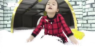 Indoor playground at center with kids pretend play toys and funny together snow play area