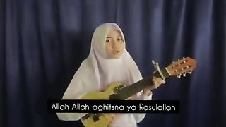 The guitar girl prays