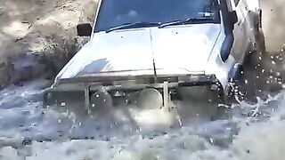 Extreme 4x4 Car Offroad Splashed in a mud pool