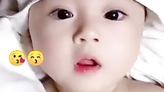 cute little baby boy with Tilawat Quran Pak