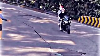 girl drives a Kawasaki zx25r