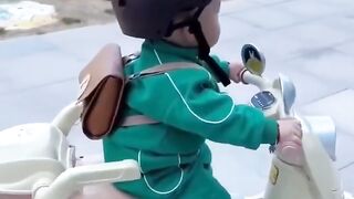 viral cute baby in toy bike