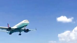 The plane flew very low over the people.