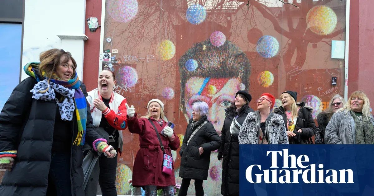 Fans gather at Brixton memorial to mark 10 years since David Bowie’s death — I.guim.co.uk