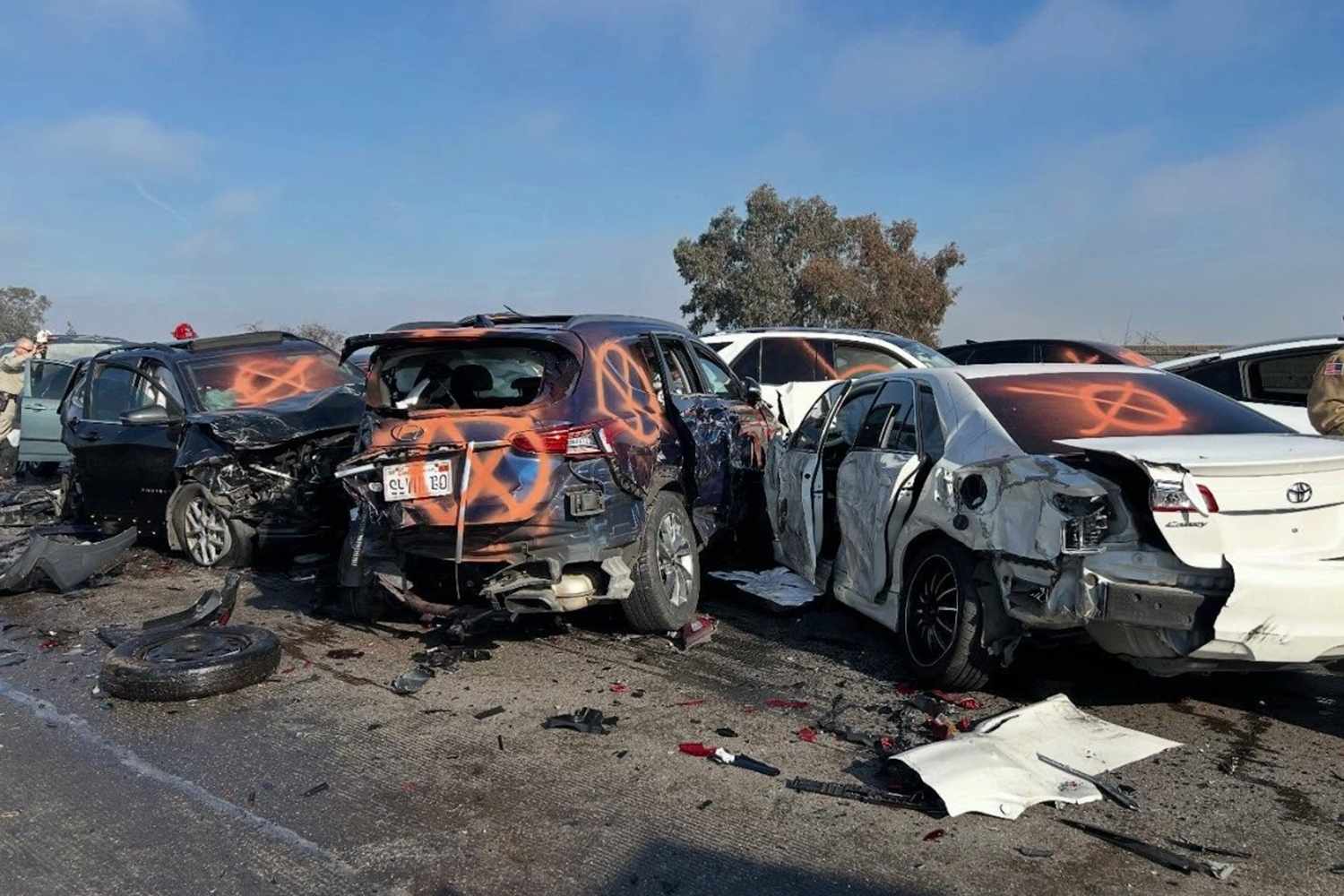 One dead and at least 20 injured in multi-vehicle pileup on Fresno's Highway 99 — People.com
