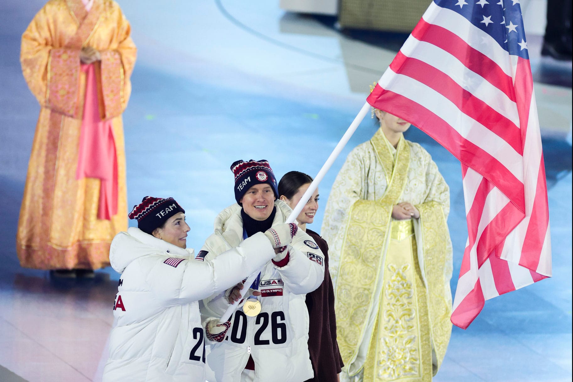 Evan Bates and Hilary Knight carry U.S. flag at Winter Games Closing Ceremony — Nbc