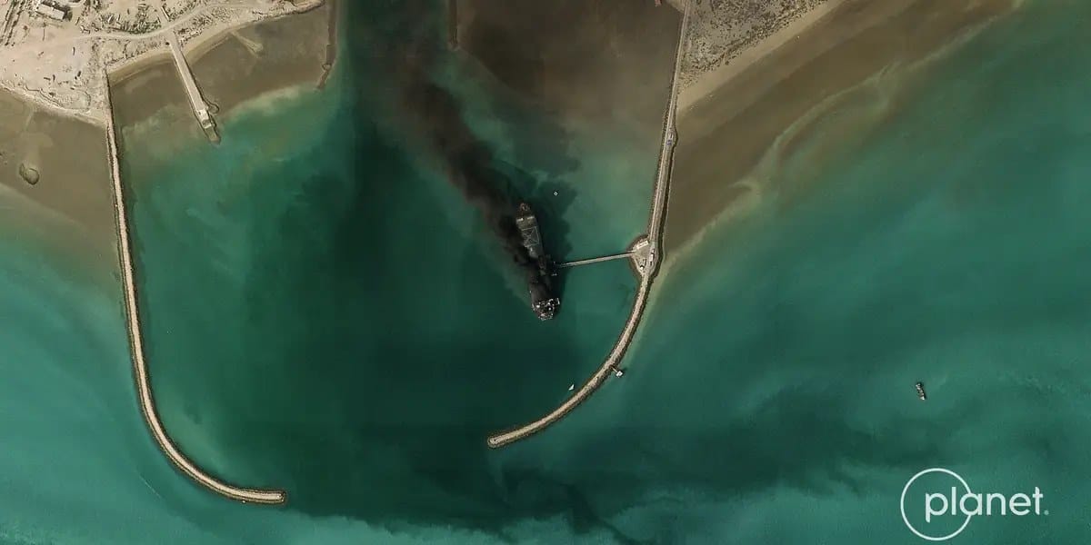Satellite image shows Iran's largest navy vessel, a former tanker, on fire — Businessinsider