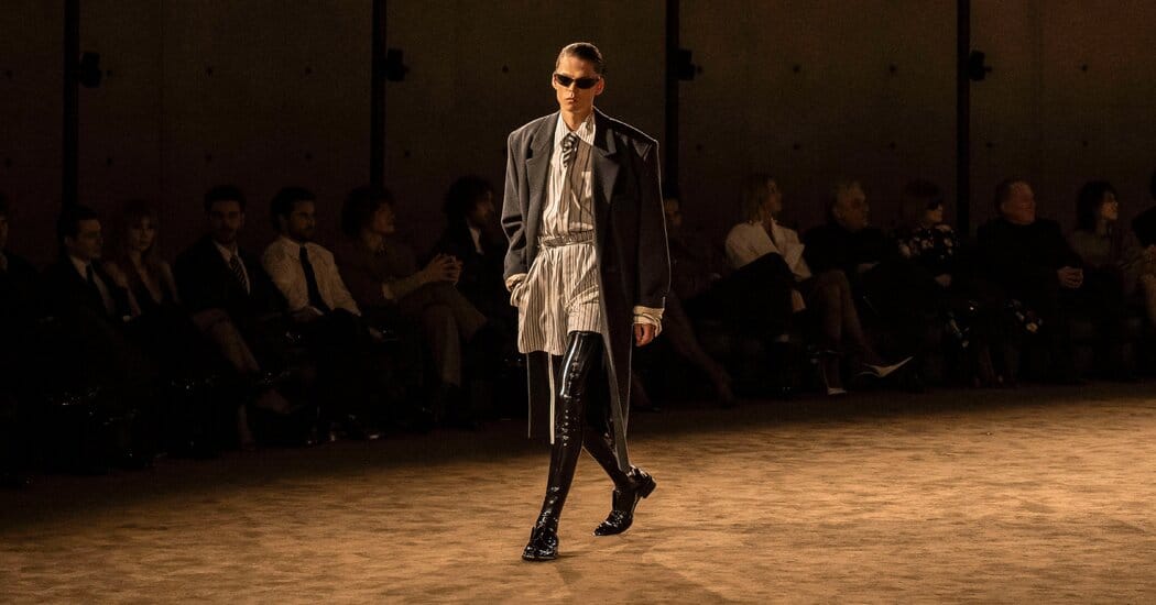 Saint Laurent debuts thigh-high patent boots at Bourse de Commerce