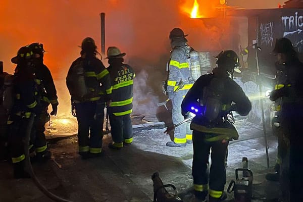Firefighter hurt by falling air conditioner in Queens five-alarm blaze — People.com