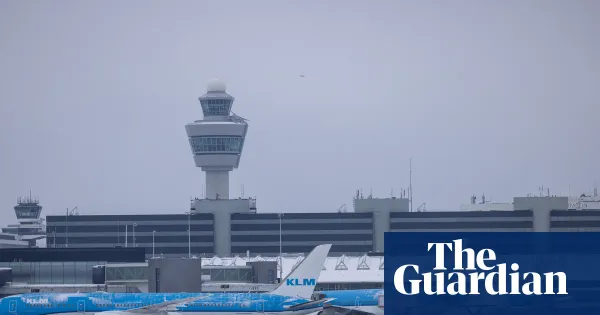 Schiphol cancels at least 700 flights as snow and wind disrupt travel — I.guim.co.uk