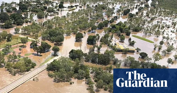 NT residents warned to avoid floodwaters as crocodiles spotted during evacuations — World news | The Guardian